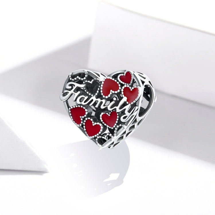 Sterling silver heart charm bead with red enamel hearts, 'Family' engraving, and cutout sides