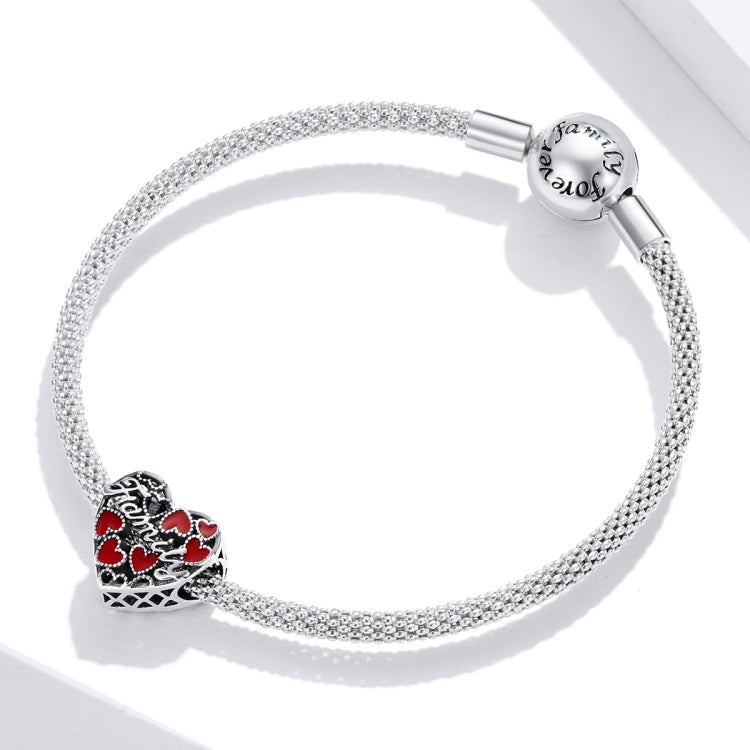 Silver mesh chain with heart charm bead, red enamel hearts, and 'Family' engraving