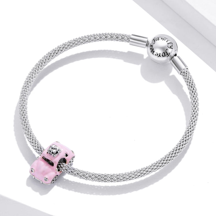 Sterling silver charm bracelet with pink car bead