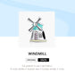 Windmill charm bead with teal enamel roof and multi-window facade, pink CZ