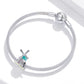 Silver bracelet with mesh chain and windmill charm bead in teal enamel, pink CZ