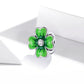 Green enamel four-leaf clover charm bead with CZ center on silver frame