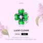 Green enamel clover charm bead with sparkling CZ center in silver scalloped ring