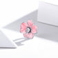 Pink enamel flower charm bead with silver frame and CZ center on ring