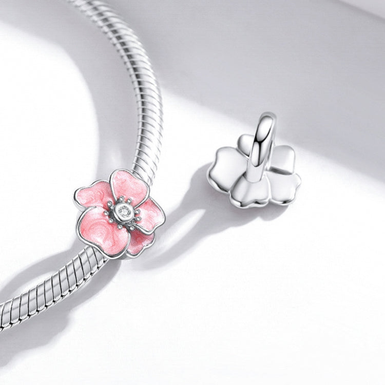 Silver snake bracelet with pink enamel flower charm and silver clasp charm
