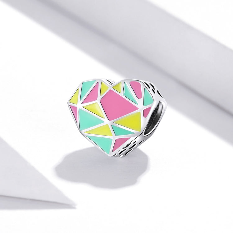 Heart-shaped sterling silver bead with multicolor geometric enamel and faceted silver edges