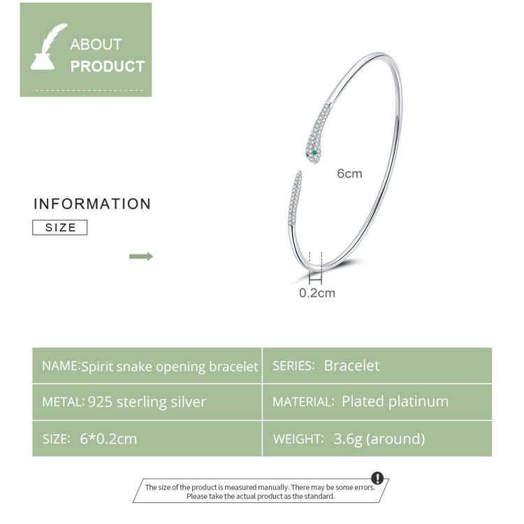 Sterling silver snake open bracelet with slim curved band and green stone accents