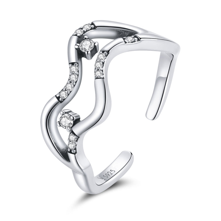 Oxidized sterling silver open ring with curved wave design and small CZ star accents