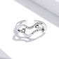 Sterling silver open band ring with swirling wave center and sparkling CZ stones
