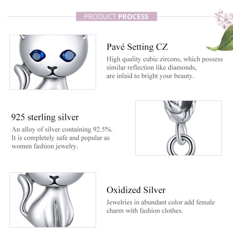 Sterling silver cat charm close-up, blue eyes with CZ sparkle setting, twisted bail