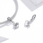 Silver-tone sloth charm bracelet with rhinestone chain and two sloth motifs