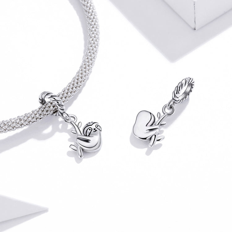 Silver-tone sloth charm bracelet with rhinestone chain and two sloth motifs