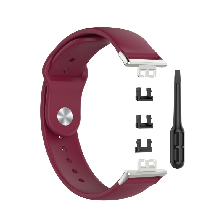 Burgundy silicone watch replacement strap with metal clasp and fitting pieces included