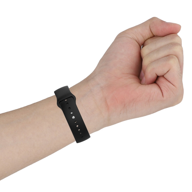 18mm black silicone watch strap on wrist with pin-hole adjustment