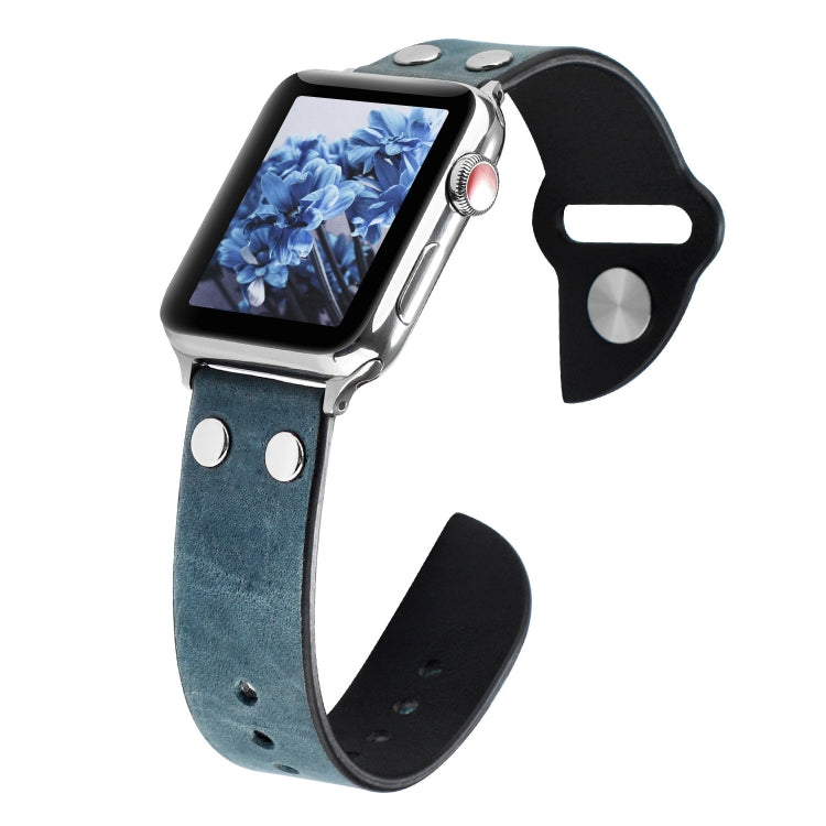Blue leather watch band with metal buckle, stud accents, and punched holes