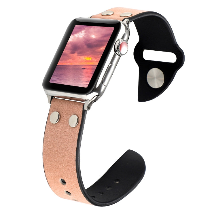 Pink leather watch band with metal buckle, stud accents, and punched holes