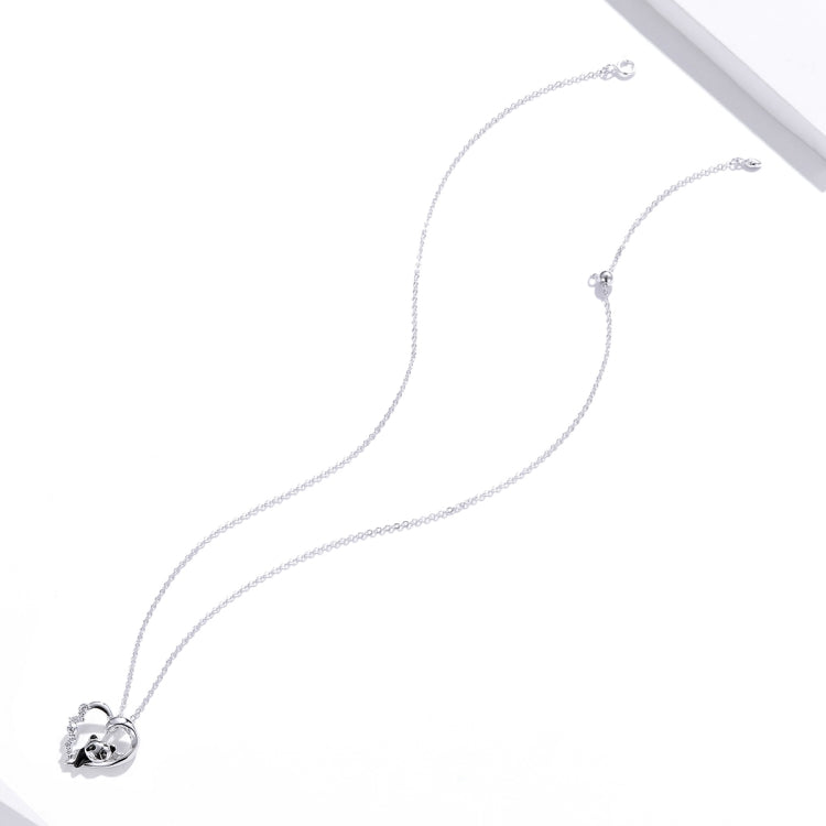 Silver chain necklace with small heart panda pendant at center, angled view