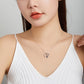 Sterling silver heart panda necklace worn on collarbone with thin chain