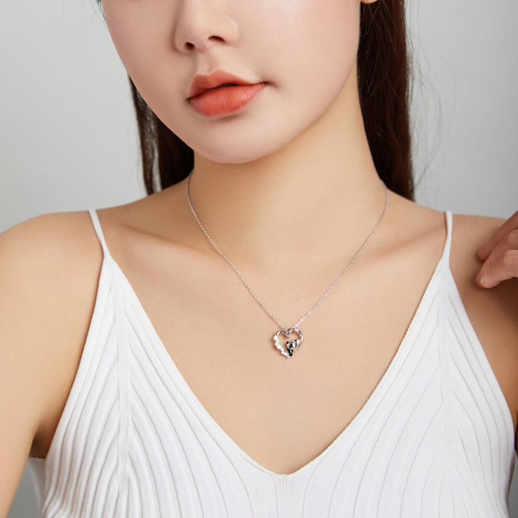 Sterling silver heart panda necklace worn on collarbone with thin chain