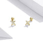 Pair of gold star stud earrings with small round CZ stone and ball post back.