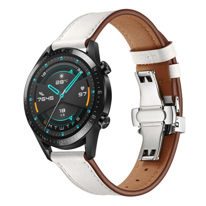White leather replacement watch strap with silver butterfly buckle, on a smartwatch