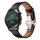 Black leather replacement watch strap with silver butterfly buckle, on smartwatch
