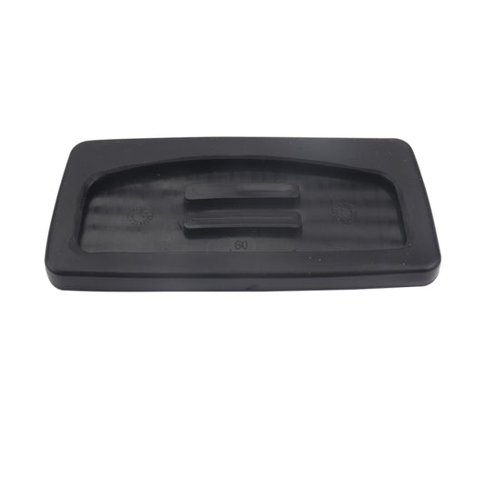 Black brake pedal cover underside with molded channels and raised center grip