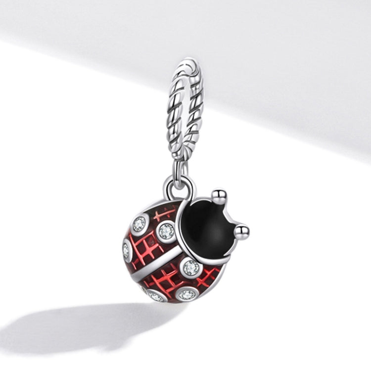 Silver ladybug pendant charm with red enamel, black center, and CZ-like accents on chain