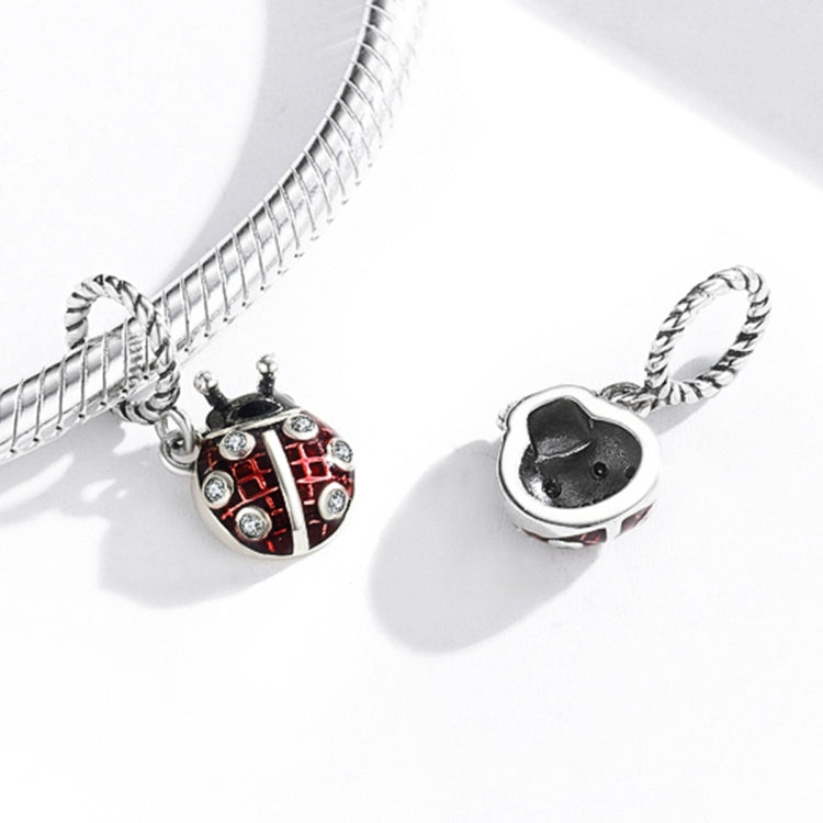 Ladybug pendant charm with red enamel on silver chain, plus rounded charm top