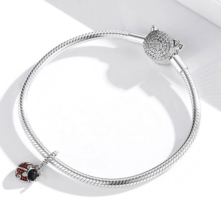 Snake-chain bracelet with silver ladybug pendant charm featuring red enamel and black center