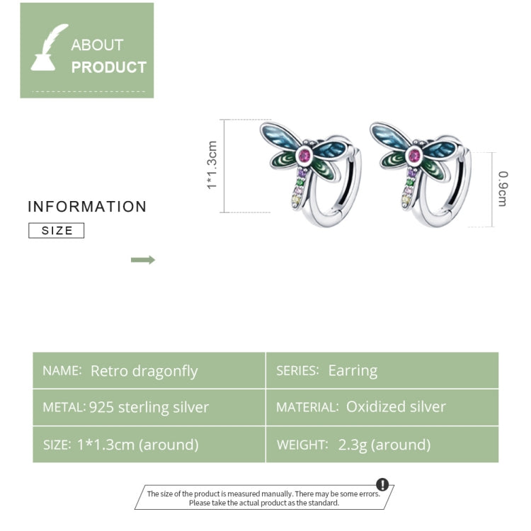 Sterling silver dragonfly ear studs with blue enamel wings, green accents, and pink gemstone