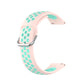 Two-color silicone watch strap, light pink with teal dot pattern and metal buckle, 22mm.
