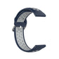 Two-color silicone watch strap, navy with light gray perforated detail and metal buckle, 22mm.