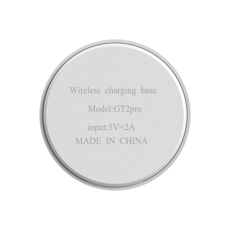 Round wireless charging base with printed specs on the back