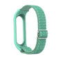 Sea green silicone watch frame with woven zigzag strap and round metal buckle clasp loop.