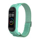 Sea green woven replacement watch strap with zigzag texture and silver metal buckle for tracker.