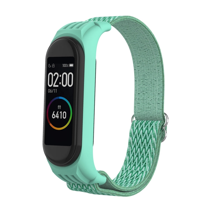 Sea green woven replacement watch strap with zigzag texture and silver metal buckle for tracker.