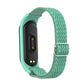 Sea green woven watch band with zigzag pattern and metal buckle clasp for activity tracker.