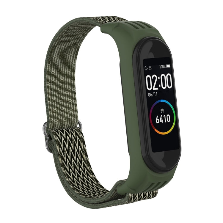 Olive green woven watch strap with zigzag pattern and metal buckle loop for fitness tracker.