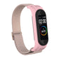 Pink replacement watch strap with woven zigzag texture and metal buckle loop for fitness tracker.