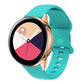 Teal silicone smartwatch band with perforated interior buckle, adjustable strap.