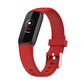 Red silicone smartwatch band with buckle and perforations; dark fitness display shown.