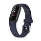 Dark blue silicone smartwatch band with buckle and perforations; dark fitness display shown.
