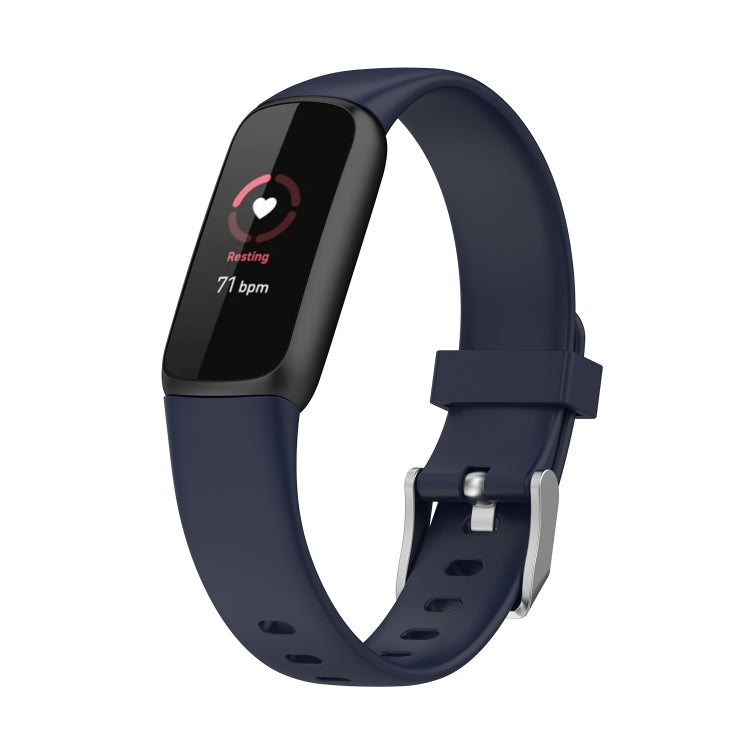 Dark blue silicone smartwatch band with buckle and perforations; dark fitness display shown.