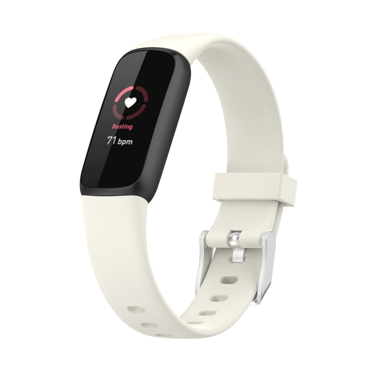 White silicone smartwatch band with buckle and perforations; dark fitness display in side view.