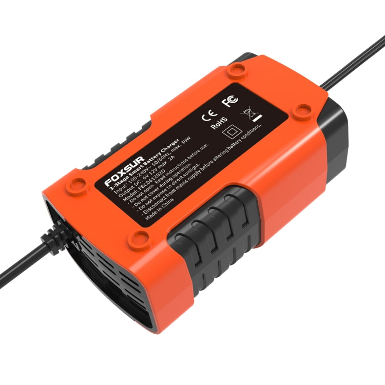 Smart battery charger underside view, orange with product label and mounting holes