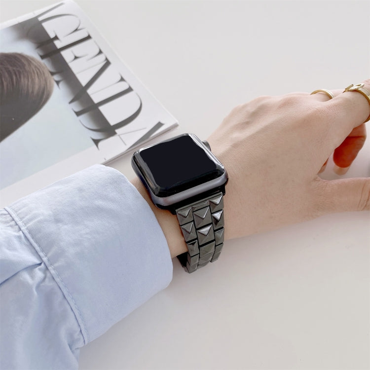 Rhombic grid ceramic watchband, black with red inlays, worn on wrist with smartwatch