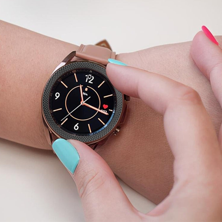 Rhombus-texture smartwatch bezel ring, rose gold finish on dark watch face with hand