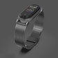 Gunmetal gray Milanese watch band with metal clasp and black smartwatch