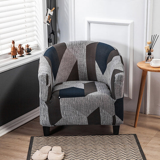 Grey geometric print sofa chair cover with bold block shapes and fitted stretch
